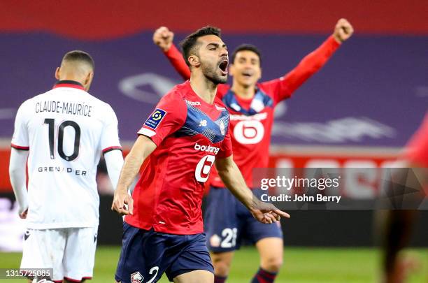 Mehmet Zeki Celik of Lille celebrates his goal with Benjamin Andre in the back during the Ligue 1 match between Lille OSC and OGC Nice at Stade...