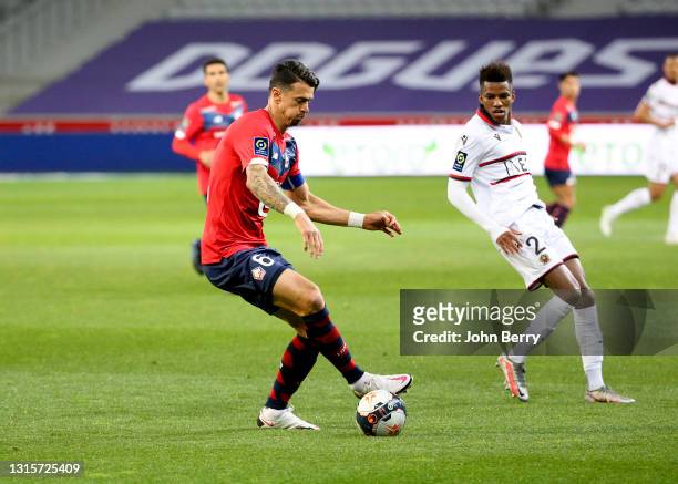 Jose Fonte of Lille, Hicham Boudaoui of Nice during the Ligue 1 match between Lille OSC and OGC Nice at Stade Pierre Mauroy on May 1, 2021 in...