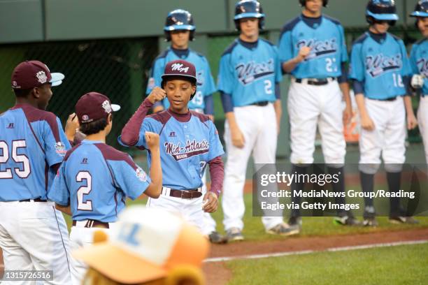 Taney Dragons pitcher Mo'ne Davis greets her teammates before the start of the game against Nevada at Lamade Stadium during the Little League World...