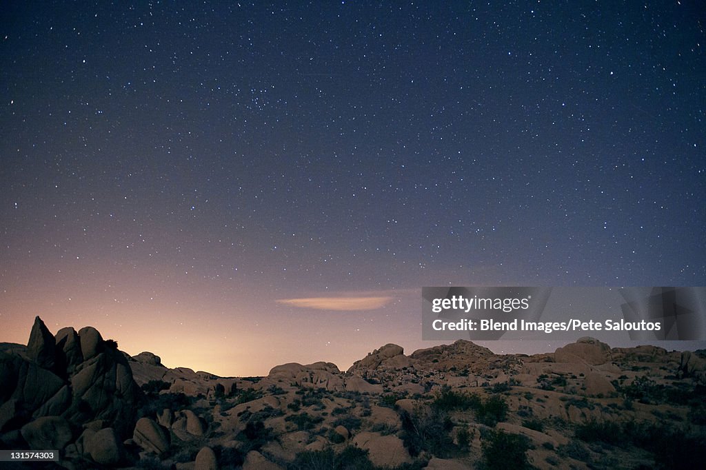 Stars in sky over desert