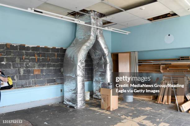 Second floor room shows where a blackboard had been and the air conditioning ductwork which had been added for the district offices. The Oley...