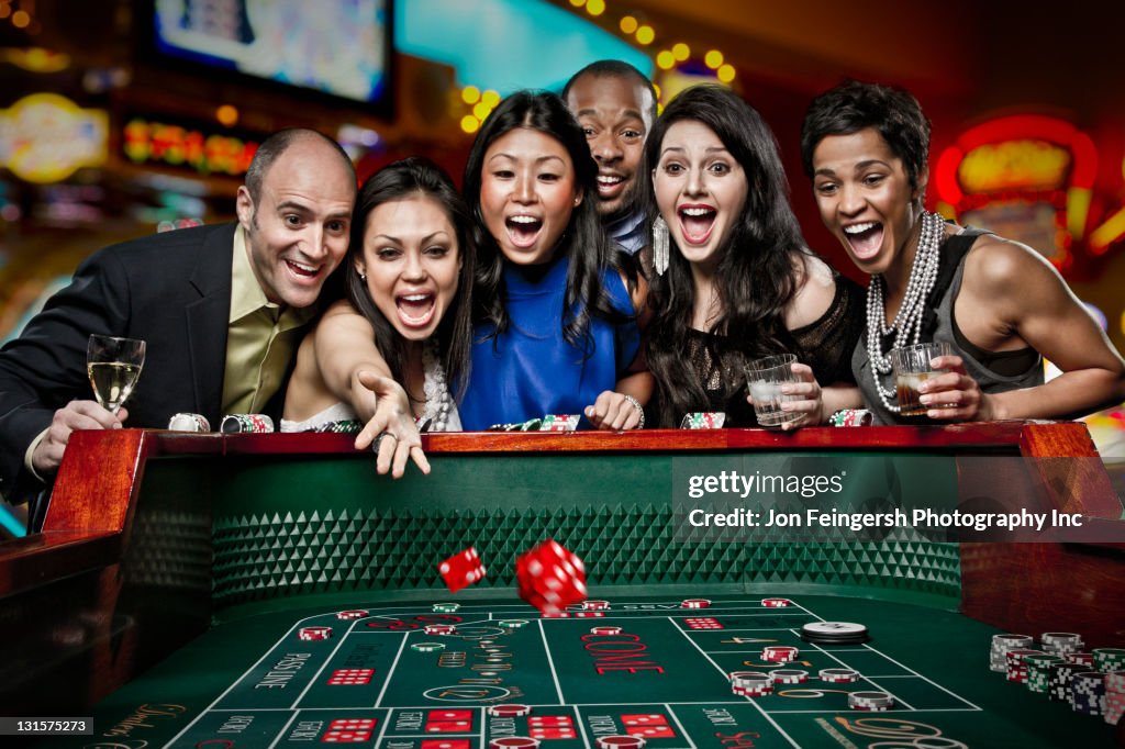 Team Craps Excited Friends Gambling At Craps Table In Casino High-Res Stock Photo ...