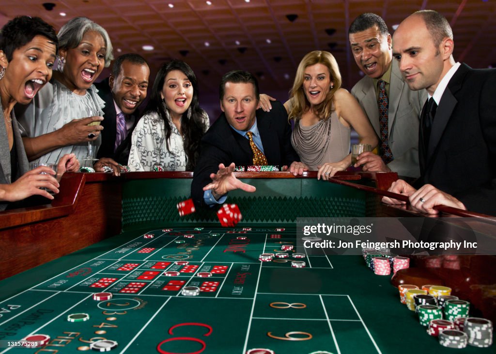 Team Craps Excited Friends Gambling At Craps Table In Casino High-Res Stock Photo ...