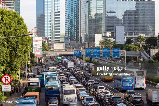 heavy traffic jam in jakarta downtown and financial district in indonesia. - jakarta stock pictures, royalty-free photos & images