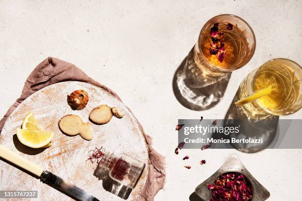 two glasses with herbal infusion and spices - mint tea stock pictures, royalty-free photos & images