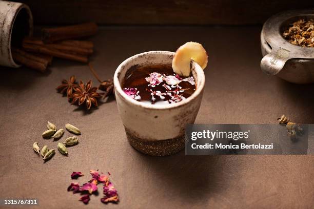 herbal rose infusion and saffron with spices - saffron stock pictures, royalty-free photos & images