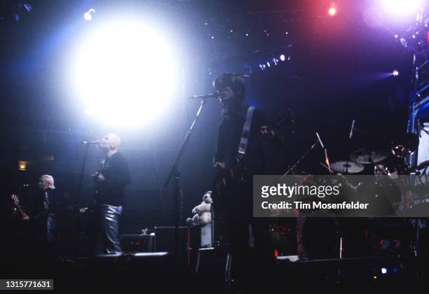 Arcy Wretzky, Billy Corgan, and James Iha of Smashing Pumpkins perform at San Jose Arena on December 16, 1996 in San Jose, California.
