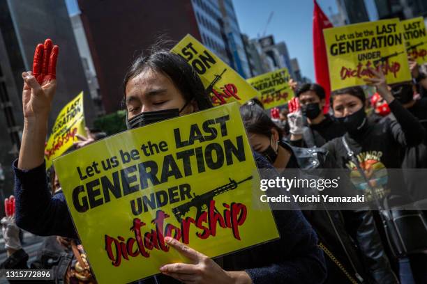 Protesters against Myanmar's military coup march through Ginza area on May 02, 2021 in Tokyo, Japan. Myanmar has now entered its fourth month under a...