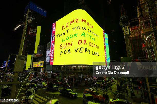 View of an electronic billboard featuring animated artwork by British artist David Hockney in Times Square on May 01, 2021 in New York City. The new...