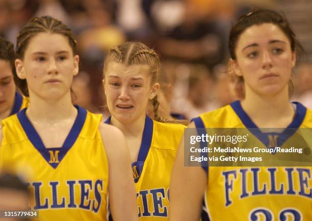 Photo by Krissy Krummenacker 200500692 Marian Catholic's Heather O'Gurek, center, cries after being defeated by Serra Catholic High School in the...