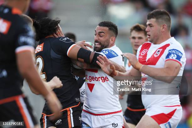 Paul Vaughan of the Dragons is tackled during the round eight NRL match between the St George Illawarra Dragons and the Wests Tigers at WIN Stadium,...