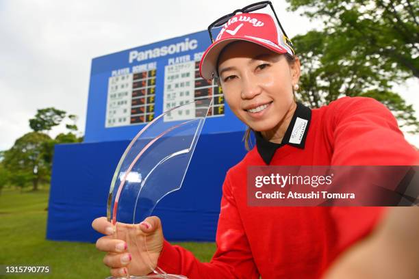 Momoko Ueda of Japan imitates a selfie after winning the tournament following the final round of the Panasonic Open at the Hamano Golf Club on May 2,...