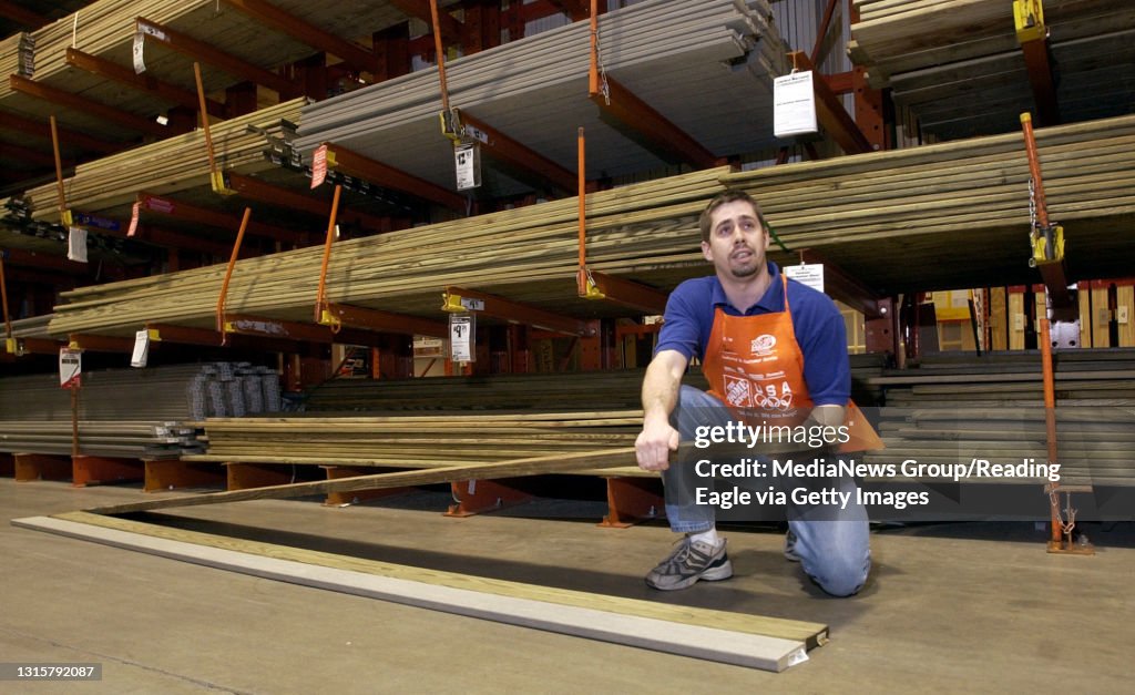 1/22/04 photo Ryan McFadden 20400229 Pressure treated lumber at Home Depot; Chris F Coy, lumber manager describes the differences in the three types of treated wood available, the older treated, the newer treated and the composite. THERE ARE JUST A FEW BO