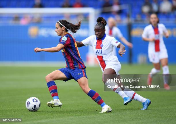 Aitana Bonmati of FC Barcelona battles for possession with Lea Khelifi of Paris Saint-Germain during the UEFA Women's Champions League Semi Final...