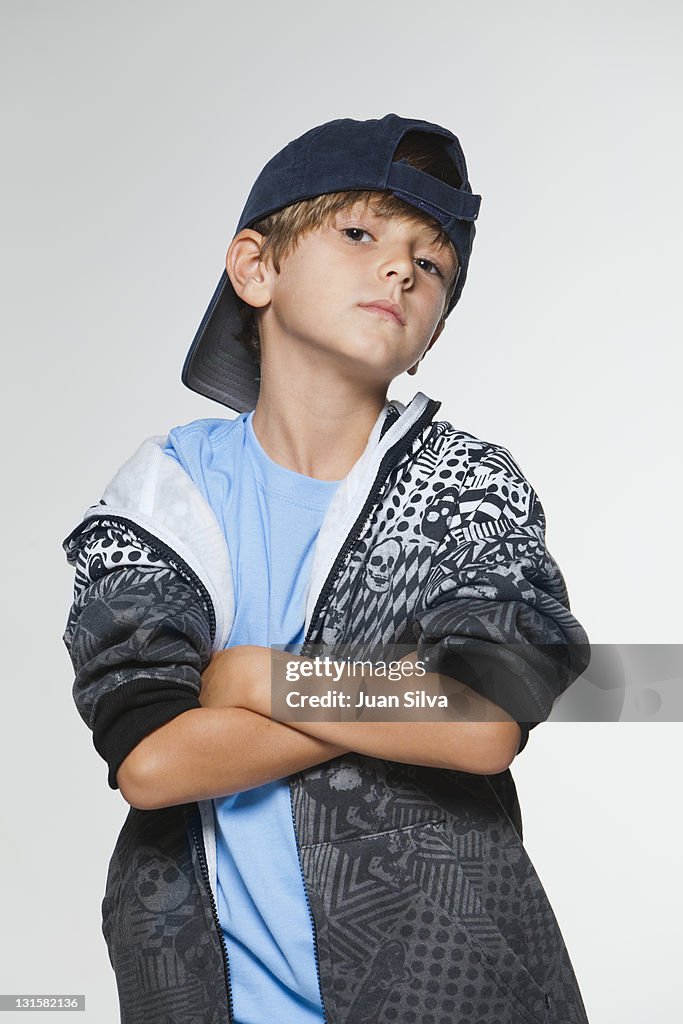 Boy (7-8) wearing a baseball cap, portrait