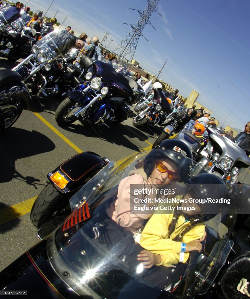 5/7/2006 Photo by Krissy Krummenacker 200601004 Miriam L. Villanueva, left, 11, who suffers from muscular dystrophy, and her sister Angela C., 9, both of South Lebanon Township, patiently wait in the side car of a motorcycle owned by Glenn A. Martin, of S