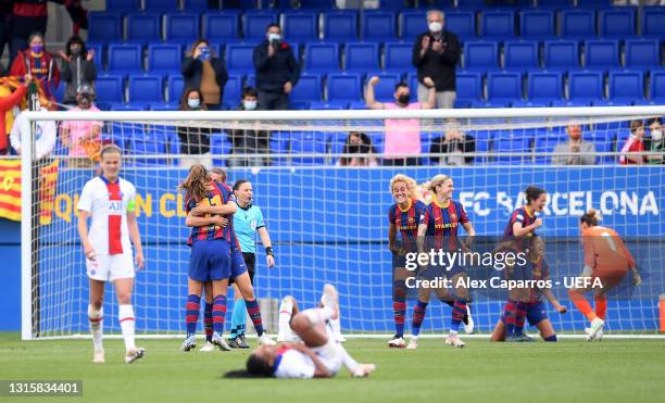 Alexia Putellas, Patricia Guijarro and Kheira Hamraoui of FC Barcelona celebrate on full time during the UEFA Women's Champions League Semi Final...