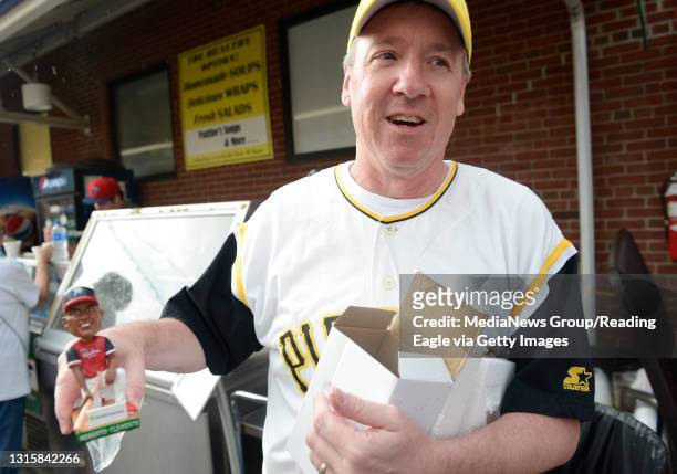 Tom Short of Malvern holds his bobblehead give away during Roberto Clemente night at the Reading Fightin Phils game on Wednesday, August 22, 2018....