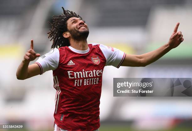 Mohamed Elneny of Arsenal celebrates after scoring their side's first goal during the Premier League match between Newcastle United and Arsenal at...