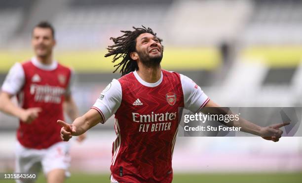 Mohamed Elneny of Arsenal celebrates after scoring their side's first goal during the Premier League match between Newcastle United and Arsenal at...