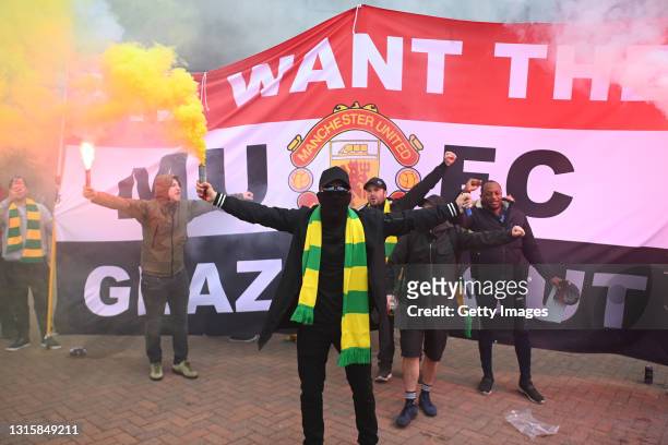 Fans are seen protesting Manchester United's Glazer ownership outside the stadium prior to the Premier League match between Manchester United and...