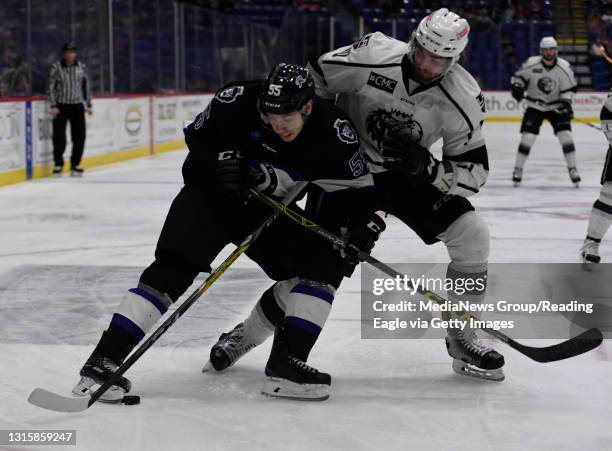 Reading forward Michael Huntebrinker battles for puck control with Manchester defenseman Tyler Elbrecht .Reading Royals lose 5-1 to the Manchester...