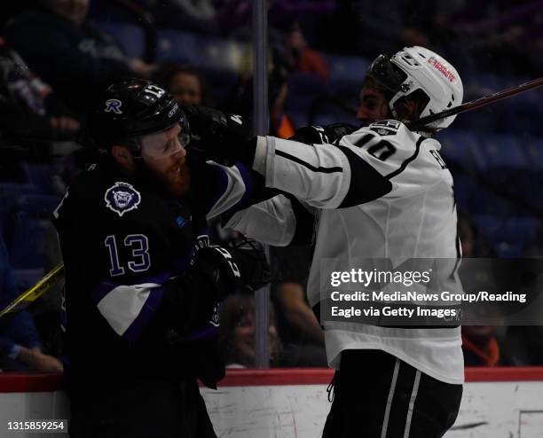 Reading forward Olivier Labelle tussles with Manchester defenseman Tyler Elbrecht .Reading Royals lose 5-1 to the Manchester Monarchs in a minor...