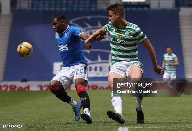 Alfredo Morelos of Rangers vies with Kris Ajer of Celtic during the Ladbrokes Scottish Premiership match between Rangers and Celtic at Ibrox Stadium...