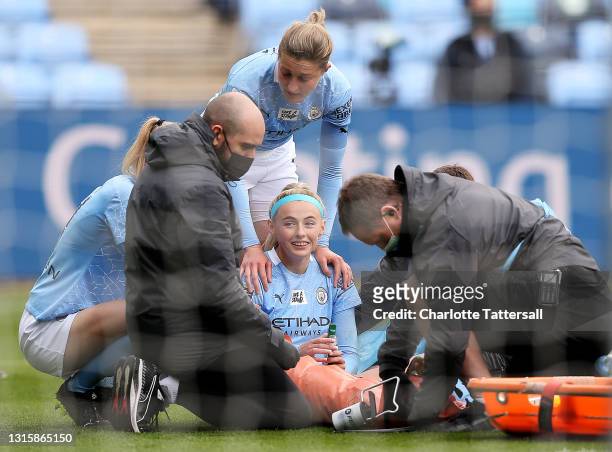 Chloe Kelly of Manchester City getting stretchered off of the pitch due to injury during the Barclays FA Women's Super League match between...