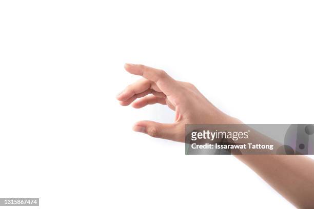 female hand reaches for something or points to something isolated on a white background - mano foto e immagini stock