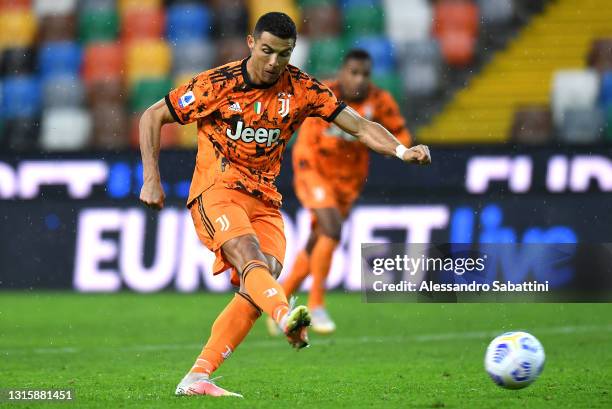 Cristiano Ronaldo of Juventus scores their side's first goal from the penalty spot during the Serie A match between Udinese Calcio and Juventus at...