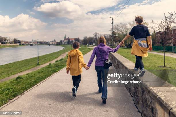mother and sons sightseeing city during covid-19 pandemic - river vistula stock pictures, royalty-free photos & images