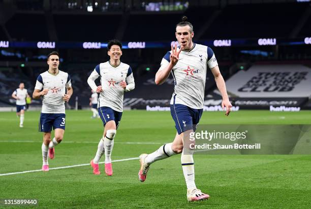 Gareth Bale of Tottenham Hotspur celebrates after scoring their side's third goal and his hat trick during the Premier League match between Tottenham...