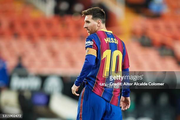 Lionel Messi of FC Barcelona looks on during the La Liga Santander match between Valencia CF and FC Barcelona at Estadio Mestalla on May 02, 2021 in...
