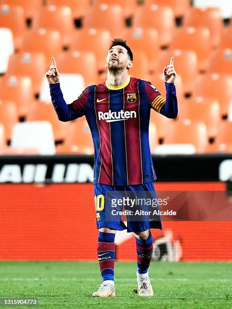 Lionel Messi of FC Barcelona celebrates after scoring their side's third goal during the La Liga Santander match between Valencia CF and FC Barcelona...