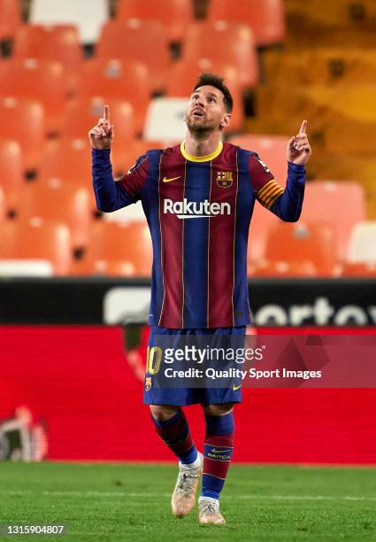 Lionel Messi of FC Barcelona celebrates after scoring his team's third goal during the La Liga Santander match between Valencia CF and FC Barcelona...