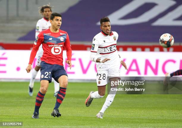 Hicham Boudaoui of Nice, Benjamin Andre of Lille during the Ligue 1 match between Lille OSC and OGC Nice at Stade Pierre Mauroy on May 1, 2021 in...