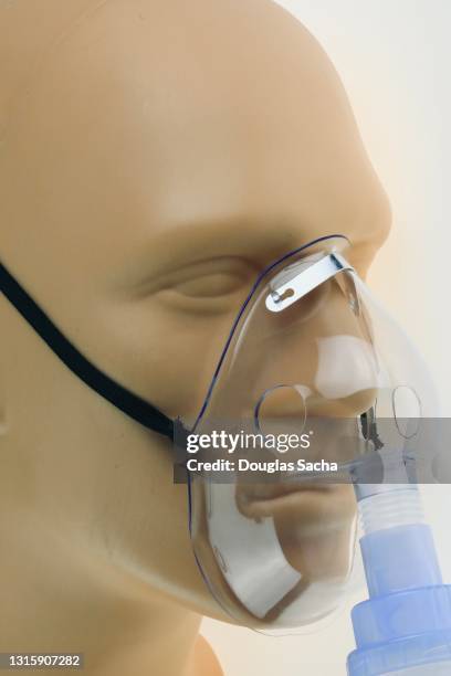 respiratory medication administering mask - oxygen mask stock pictures, royalty-free photos & images