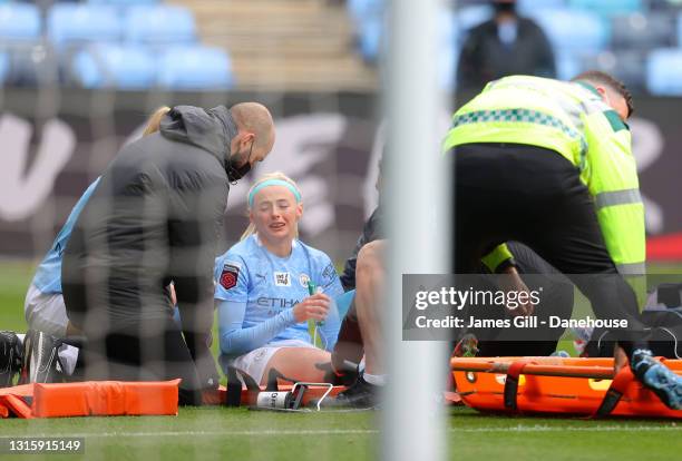 Chloe Kelly of Manchester City Women lies injured after clashing with Rebecca Holloway of Birmingham City Women during the Barclays FA Women's Super...