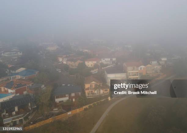 An aerial view of heavy smoke haze and fog over Maroubra on May 03, 2021 in Sydney, Australia. Fog combined with smoke haze has blanketed Sydney on...