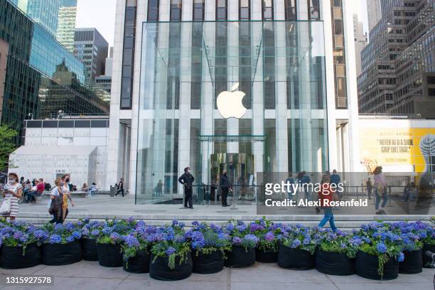 Flowers are displayed outside the Apple Store at the Fifth Avenue Blooms Mother’s Day installation along Fifth Avenue amid the coronavirus pandemic...