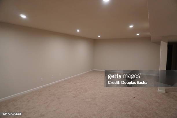 finished basement in newer home - basement stock pictures, royalty-free photos & images