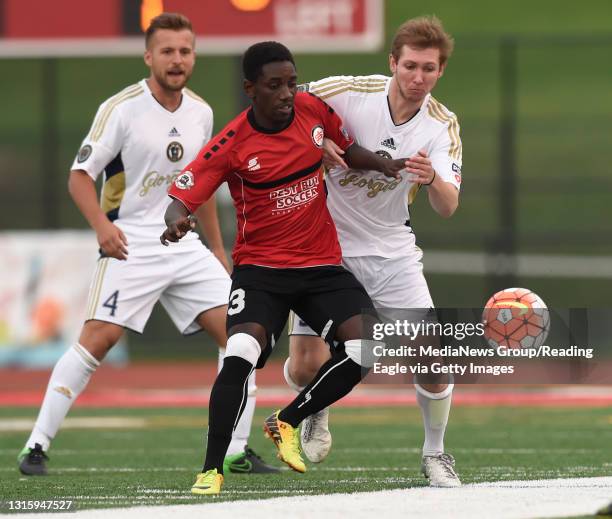 Reading's William McConnell pressures Atlanta's Douglas Diwa .Reading United AC defeat the Atlanta Silverbacks 2-0 in a U.S. Open Cup first round...