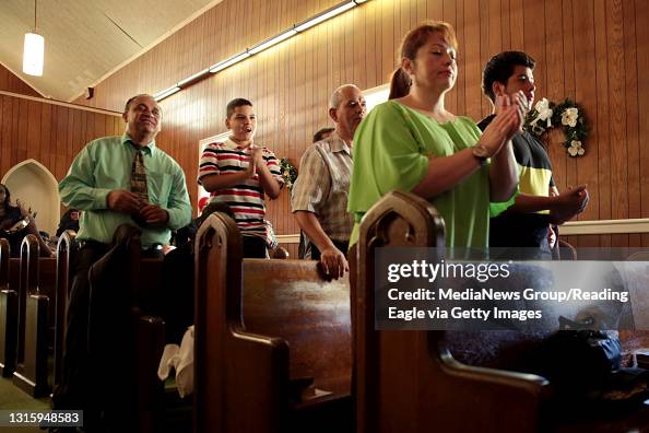 Members of the congregation sing during unity day at God's Worship ...