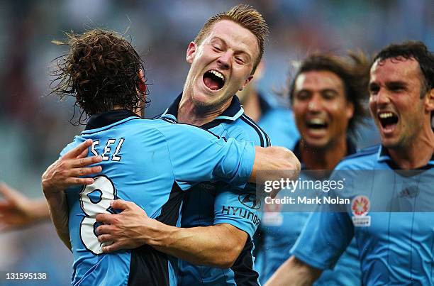 Karol Kisel of Sydney celebrates a penalty goal to win the match with team mate Scott Jamieson during the round five A-League match between Sydney FC...