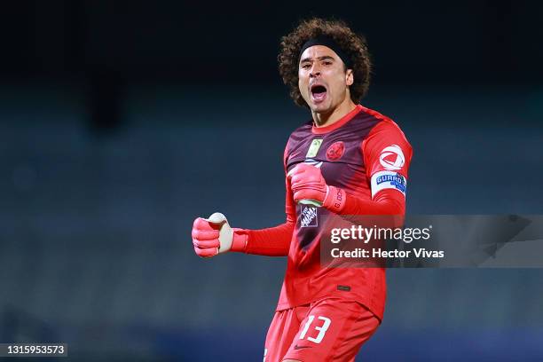 Gillermo Ochoa of America celebrates after the first goal of his team during the 17th round match between Pumas UNAM and America as part of the...