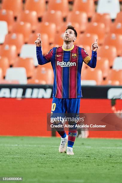 Lionel Messi of FC Barcelona celebrates after scoring their side's third goal during during the La Liga Santander match between Valencia CF and FC...