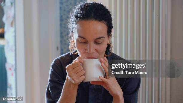 woman drinking tea - english tea room stock pictures, royalty-free photos & images