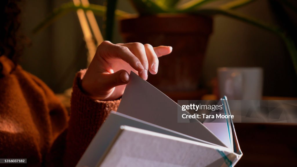 Close up of hands with book