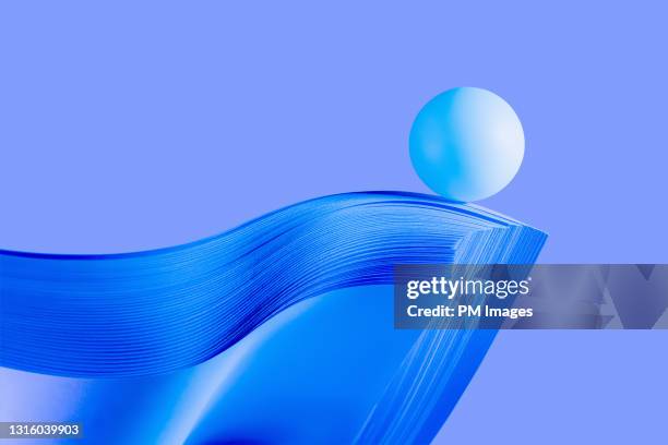 ball on paper's edge - curiosity abstract stock pictures, royalty-free photos & images